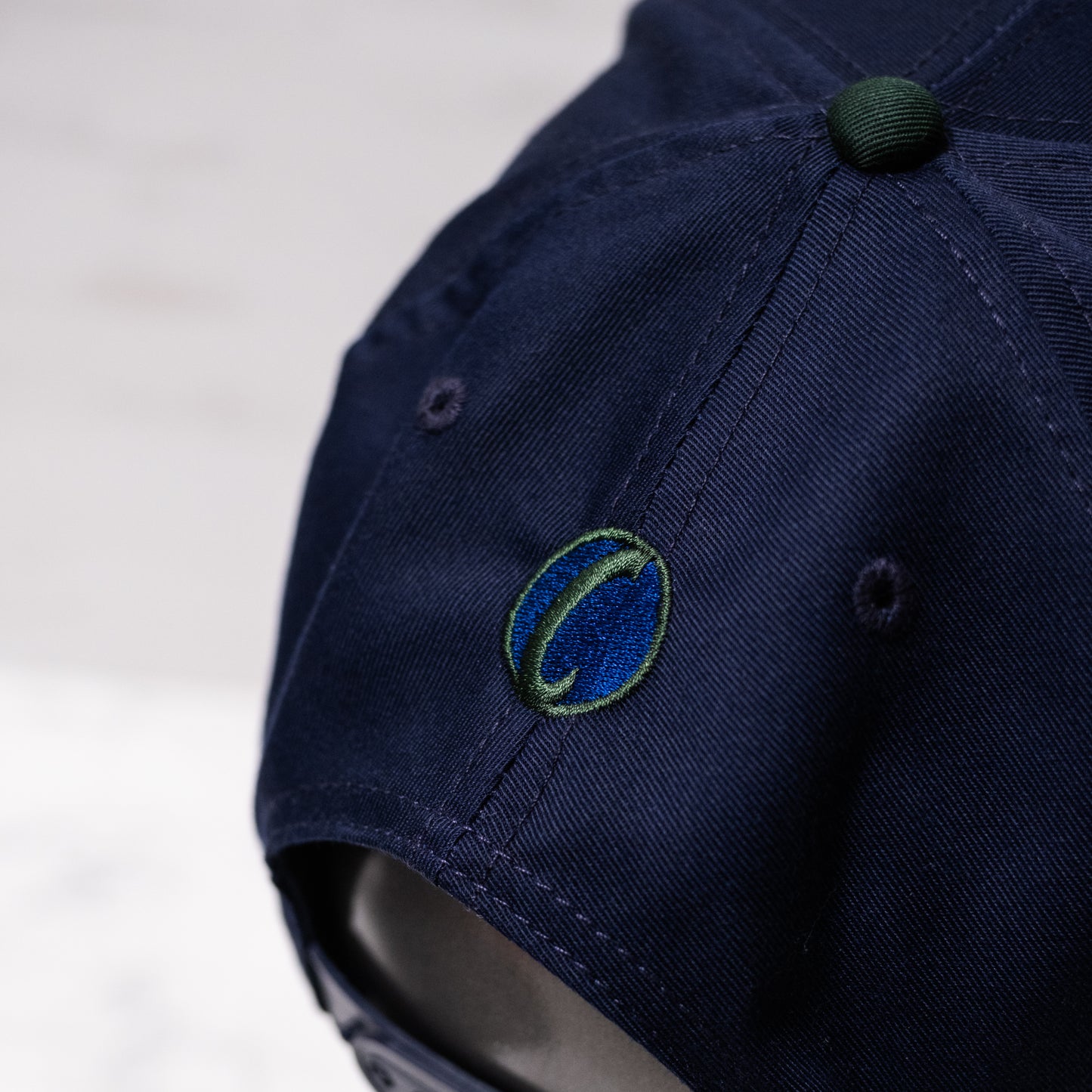 1 of 1 Capsmith Shark Baseball Cap on Nvy/Drk Green