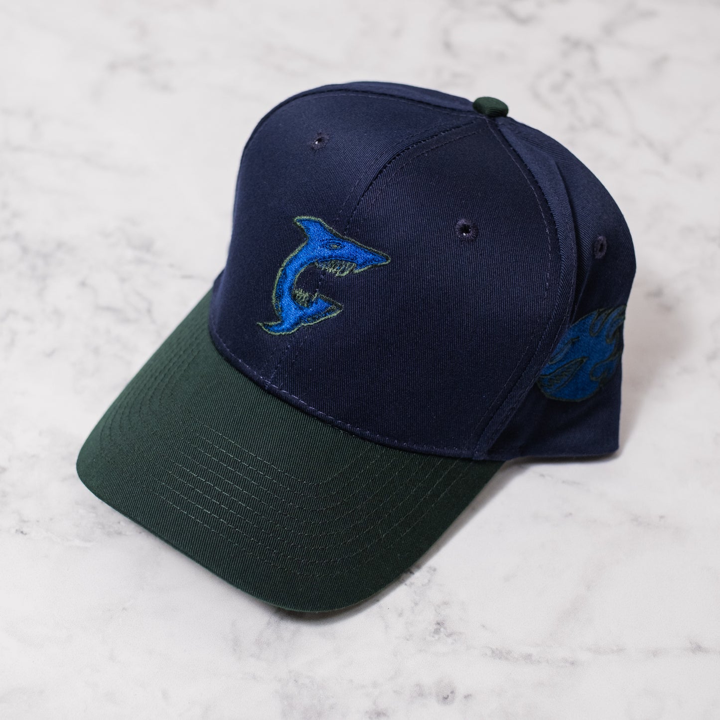 1 of 1 Capsmith Shark Baseball Cap on Nvy/Drk Green