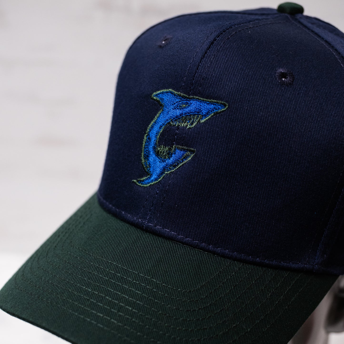 1 of 1 Capsmith Shark Baseball Cap on Nvy/Drk Green